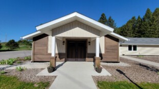 Entrance to Pine Hall showing covered cement walkway